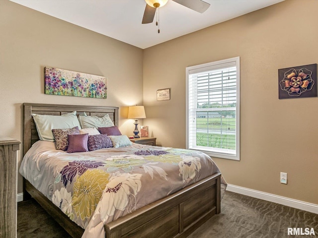 bedroom featuring dark carpet and ceiling fan