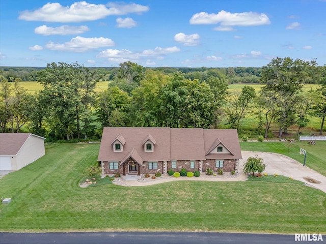 view of front of home featuring a front yard and a rural view