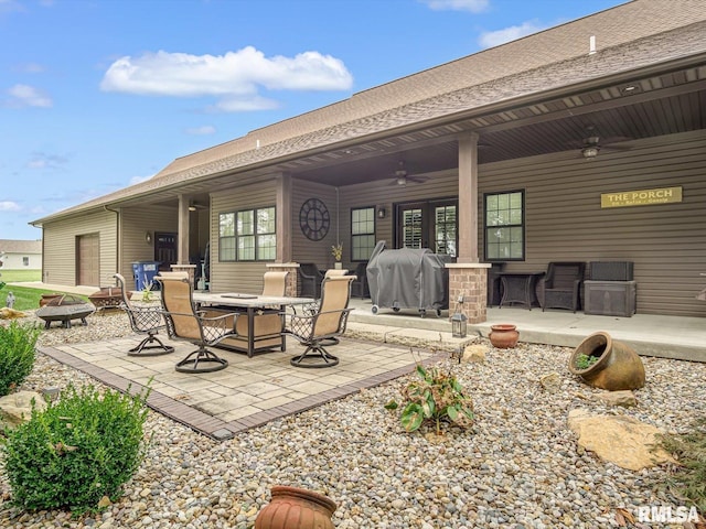 view of patio featuring ceiling fan and a grill