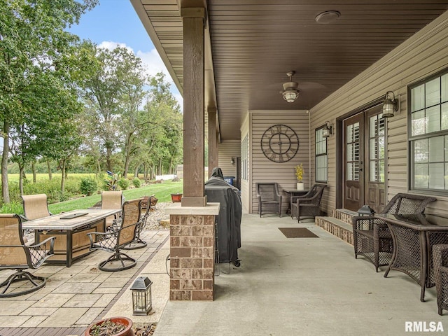 view of patio featuring a grill