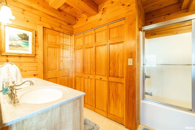 full bath featuring beamed ceiling, wood ceiling, shower / bath combination with glass door, tile patterned floors, and a sink