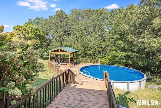 pool featuring a gazebo and a wooden deck