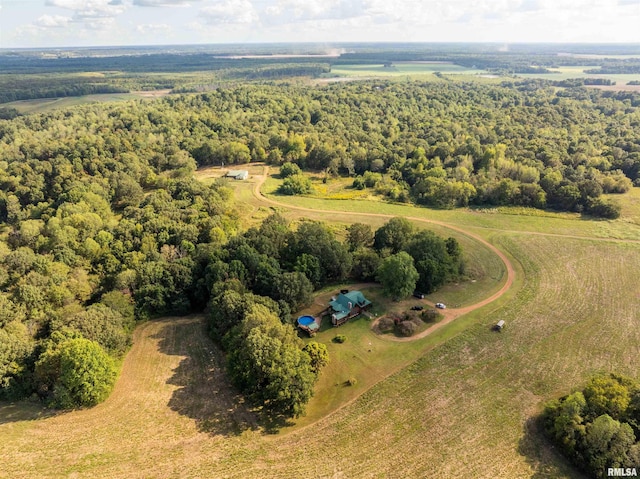 birds eye view of property with a forest view and a rural view