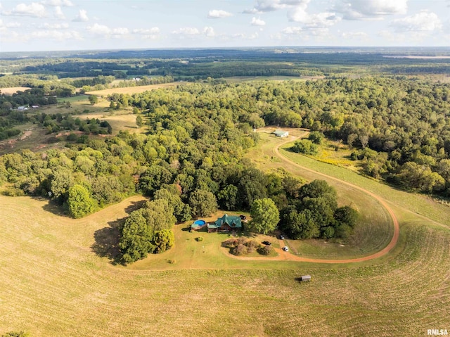 bird's eye view with a wooded view