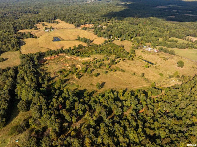 bird's eye view featuring a wooded view