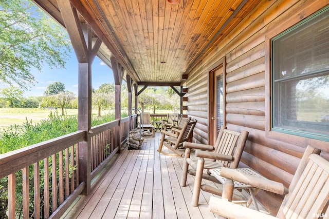 wooden terrace featuring a porch