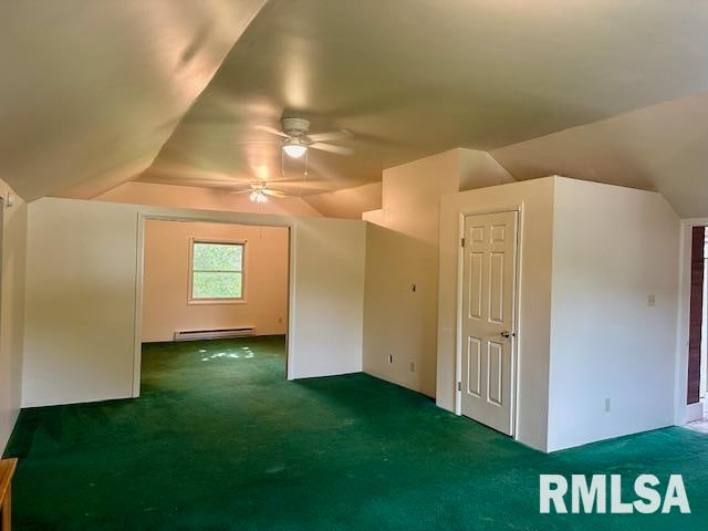 additional living space with ceiling fan, baseboard heating, vaulted ceiling, and dark carpet