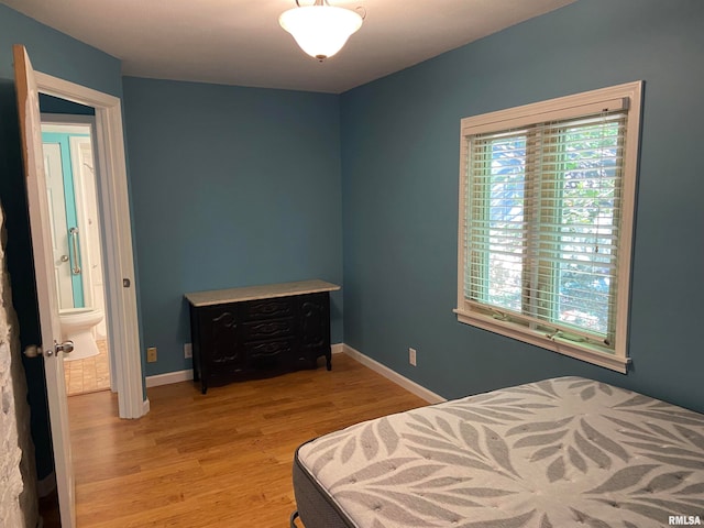 bedroom with light wood-type flooring