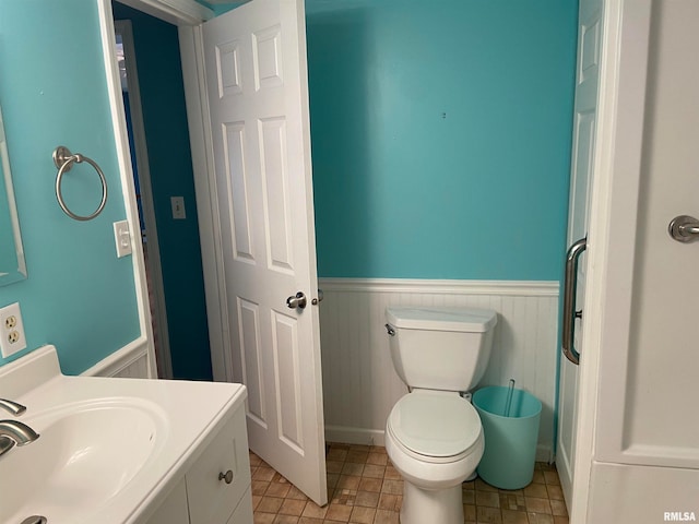 bathroom with vanity and toilet