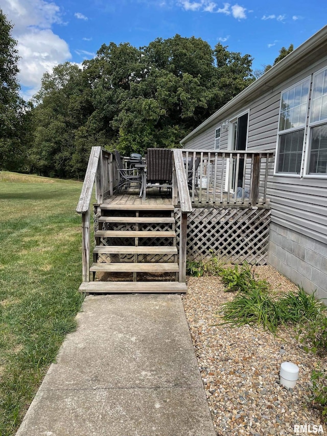 wooden terrace with a yard