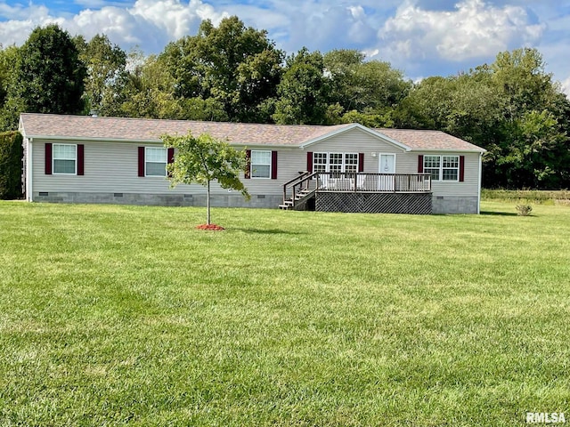 view of front facade with a wooden deck and a front lawn