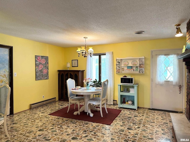 dining area with a baseboard radiator, a textured ceiling, and an inviting chandelier