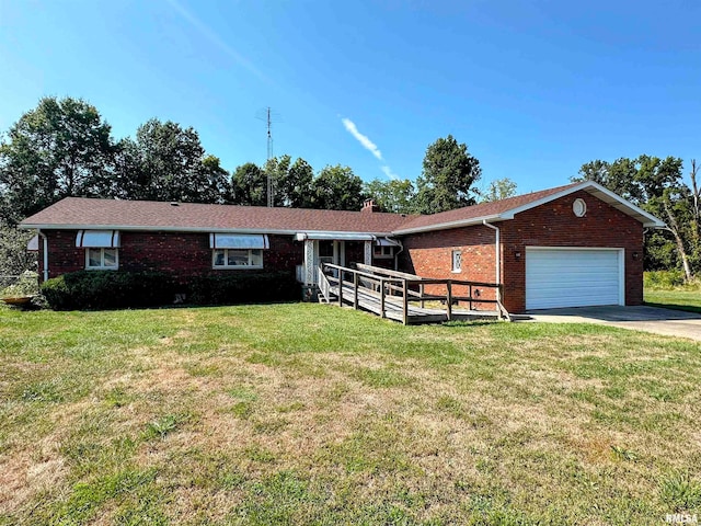 ranch-style house featuring a garage and a front lawn