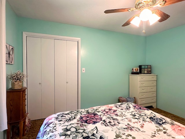 bedroom featuring dark carpet, a closet, and ceiling fan