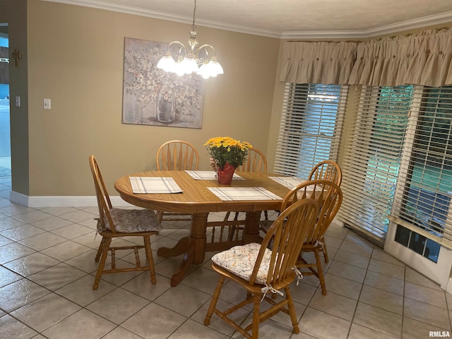 dining area featuring crown molding, an inviting chandelier, and light tile patterned floors