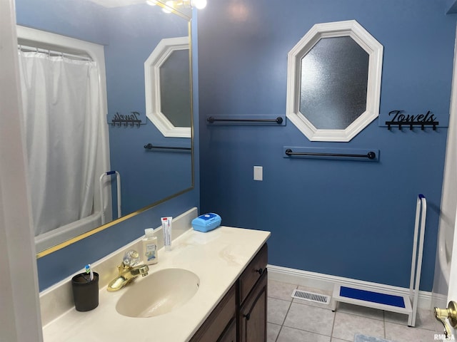 bathroom with vanity and tile patterned flooring