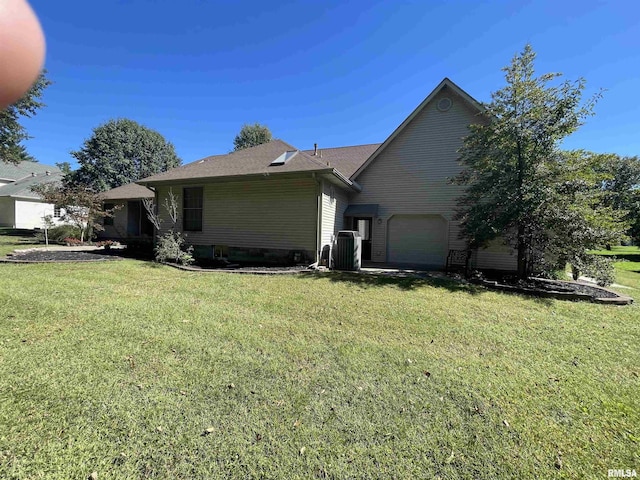 exterior space featuring central AC and a front lawn