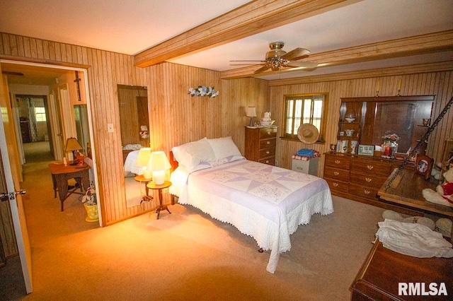 bedroom with carpet, beam ceiling, and ceiling fan