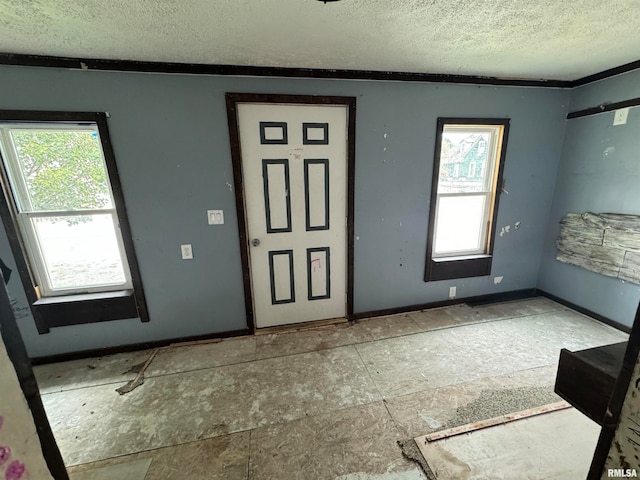 foyer with a textured ceiling