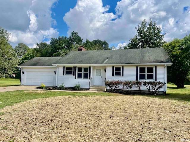 single story home featuring a garage and a front lawn