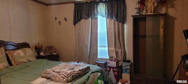 bedroom featuring ornamental molding