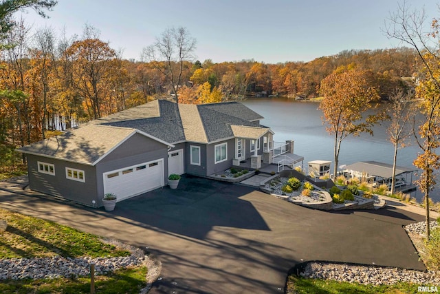 view of front facade featuring a water view and a garage