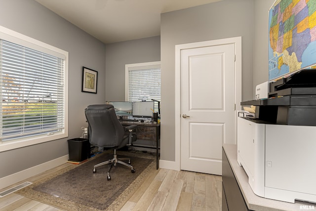 office area with light wood-type flooring