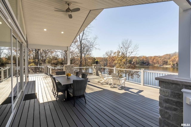 wooden terrace with ceiling fan and a water view