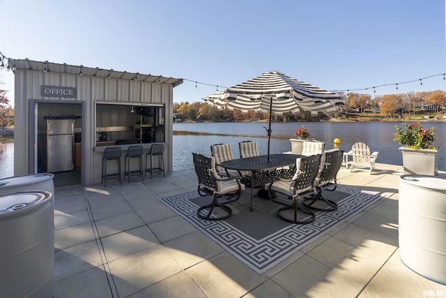 view of patio with a water view