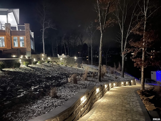 view of yard at twilight