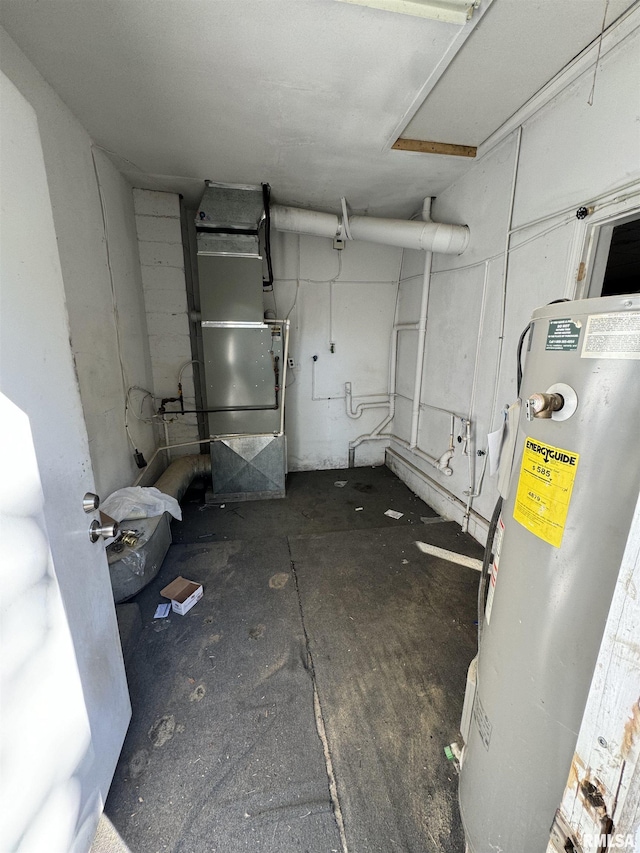 basement featuring water heater and heating unit