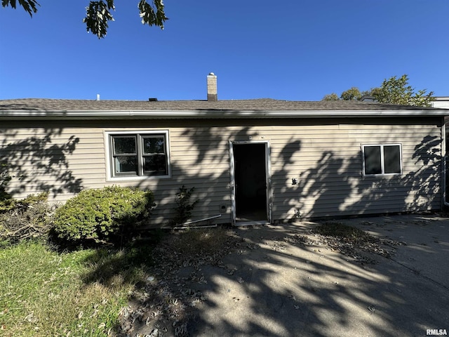view of front of home with a chimney
