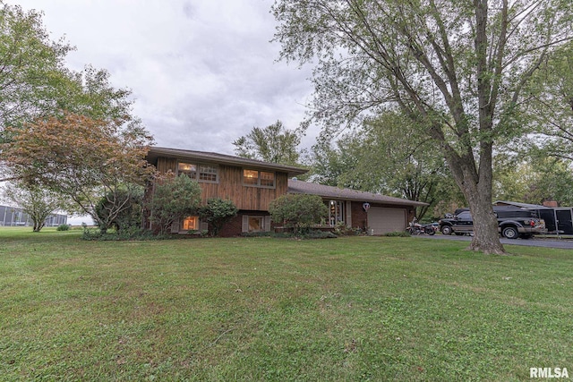 2022 W Main St, Salem, IL 62881 - view of front of house with an attached garage, brick siding, and a front yard