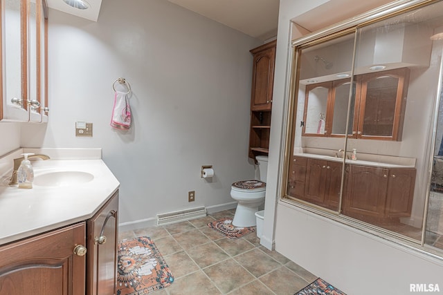 bathroom featuring vanity, toilet, tile patterned flooring, and an enclosed shower