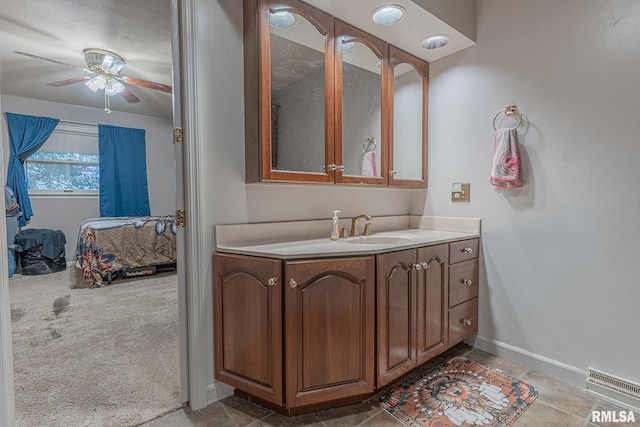 2022 W Main St, Salem, IL 62881 - ensuite bathroom featuring a ceiling fan, visible vents, baseboards, ensuite bathroom, and vanity
