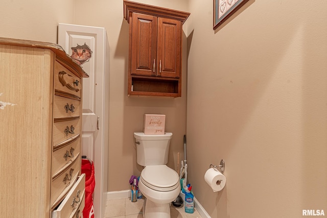 bathroom featuring toilet and tile patterned flooring