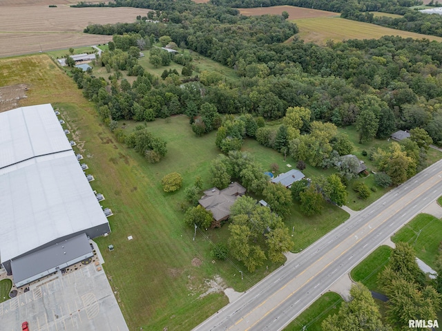 birds eye view of property with a rural view