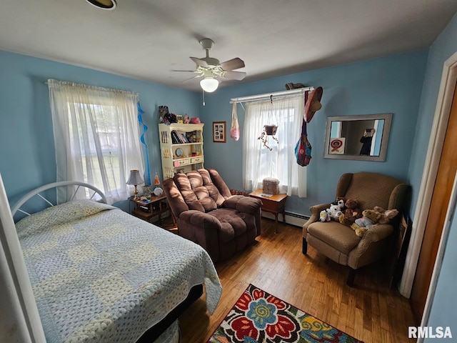 bedroom featuring ceiling fan and hardwood / wood-style flooring