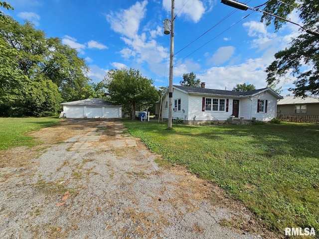 view of front of house with an outdoor structure, a garage, and a front lawn