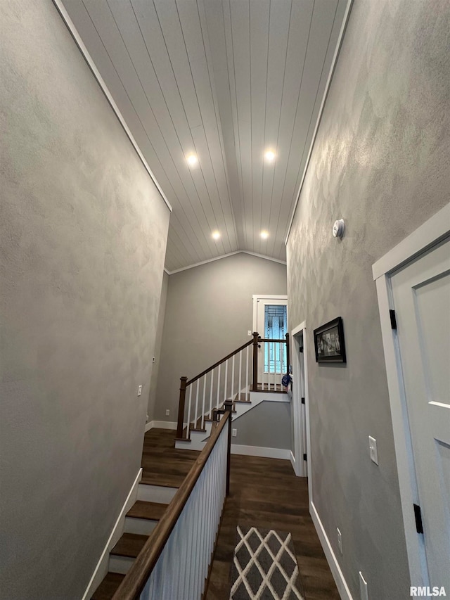 staircase with wooden ceiling, crown molding, vaulted ceiling, and hardwood / wood-style floors