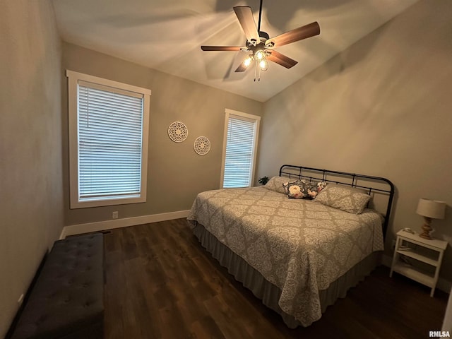 bedroom with lofted ceiling, dark wood-type flooring, and ceiling fan