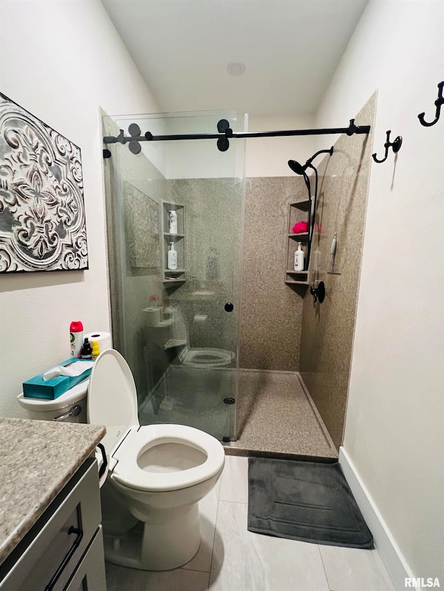 bathroom with vanity, tile patterned flooring, an enclosed shower, and toilet