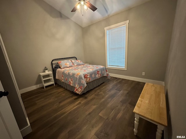 bedroom with ceiling fan and dark hardwood / wood-style floors