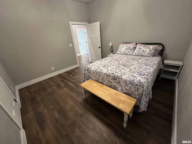 bedroom featuring dark wood-type flooring