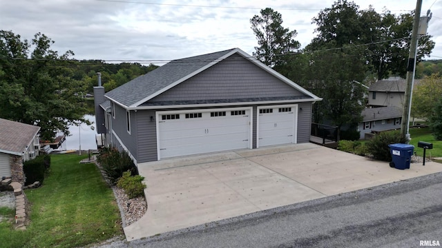 garage featuring a lawn