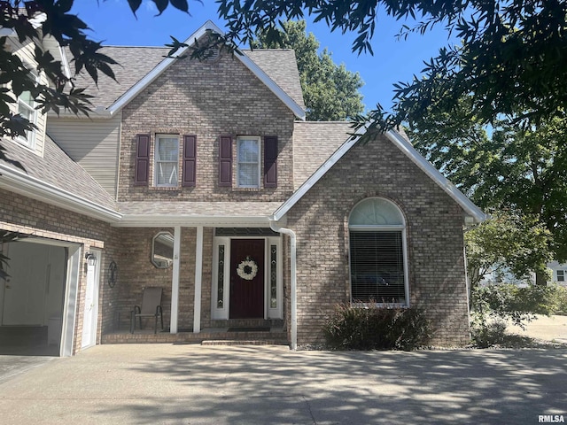 1803 N Dawn Dr, Marion, IL 62959 - traditional-style home with driveway, brick siding, a shingled roof, and a garage
