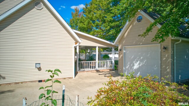 view of side of home featuring a garage