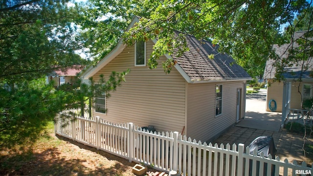 view of side of property featuring a patio