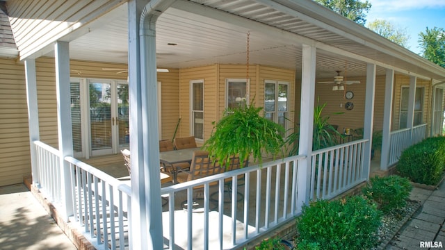 view of side of home with ceiling fan and covered porch