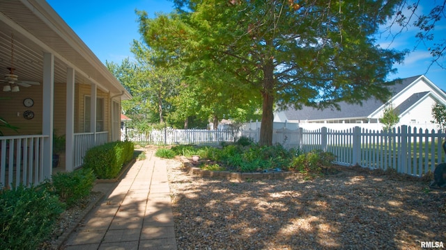 view of yard featuring ceiling fan